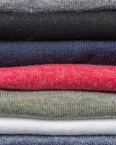 Folded cotton tees in black, navy, red, sage and grey